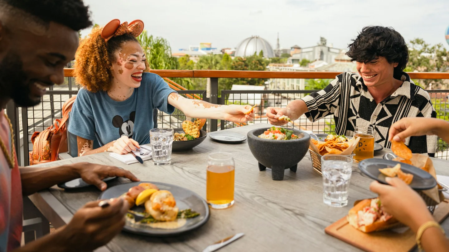 Guests eating outdoors at Paddlefish in Disney Springs