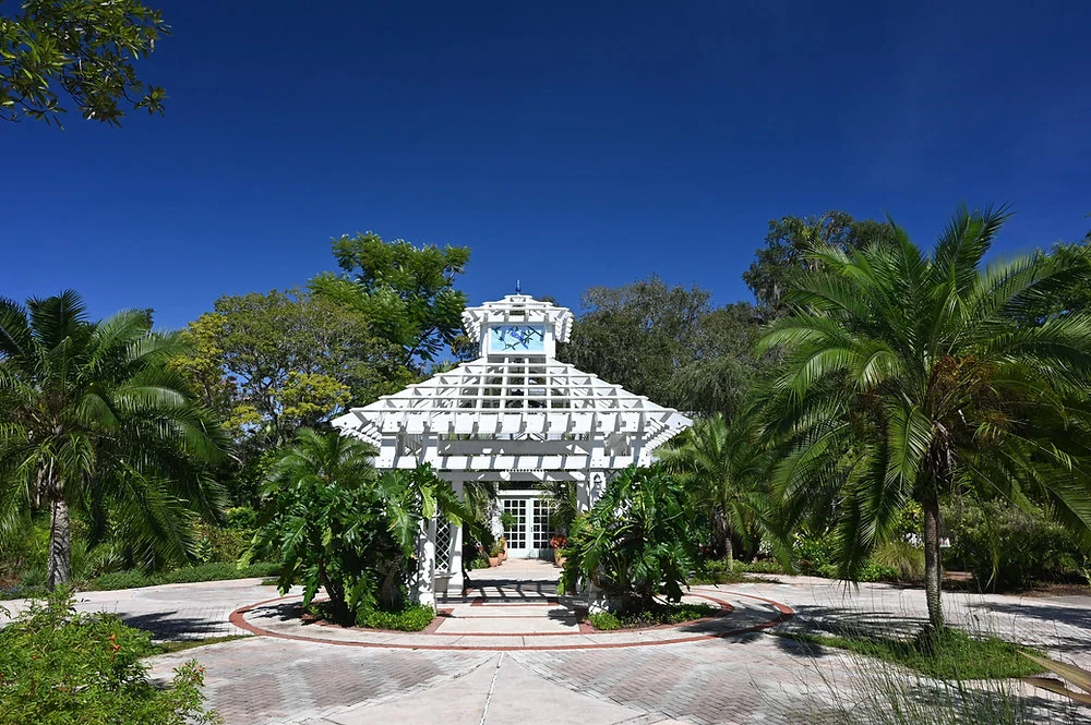 White gazebo and paths surrounded by tropical planting at Leu Gardens